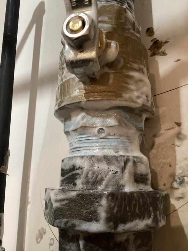 Responded to error code indicating gas leak on tanked water heater. Performed leak detection test using soap solution on pipe joints, confirming previous repair by gas company had resolved the main leak. Reset error code and verified proper heater operation.