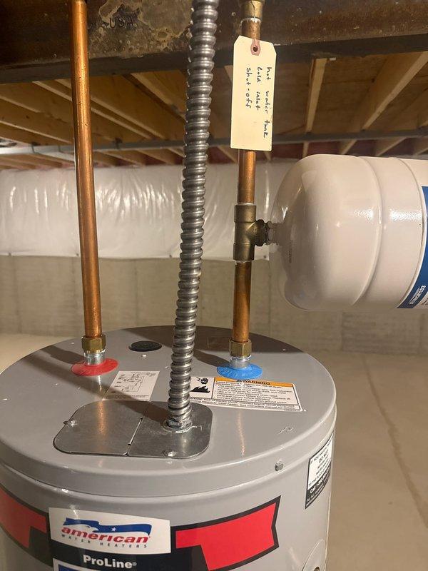 Performed scheduled maintenance on American ProLine tanked water heater, including complete flush and fill service. Inspected all components including expansion tank, pressure relief valve, and copper supply lines, confirming proper operation and no signs of leaks or deterioration. System left in optimal working condition with all connections secure.
