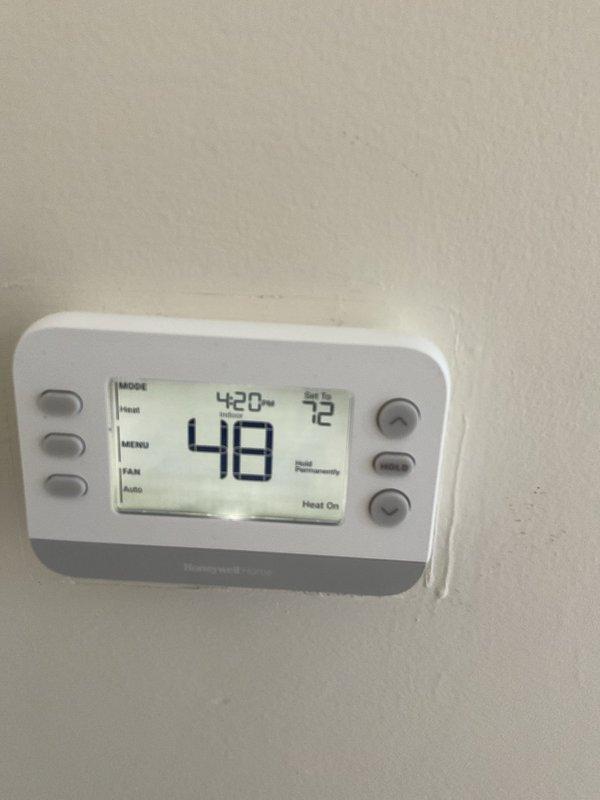 Responded to no-heat call for residential furnace system. Discovered significant temperature differential between actual reading (48°) and thermostat setpoint (72°) despite "Heat On" status. Diagnosed faulty ignition sequence, replaced flame sensor and verified proper system operation. System now maintaining desired temperature with normal heating cycle.