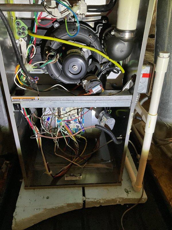 Diagnosed and serviced ComfortMaker furnace that was not producing heat. Upon inspection of the internal components, found faulty wiring connections at the blower motor assembly. Repaired loose connections, cleaned electrical contacts, and verified proper operation of all safety switches. System now functioning correctly with consistent heat output.