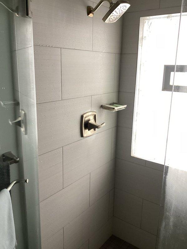 Responded to customer complaint regarding insufficient hot water supply from recently installed tank water heater. Customer reported hot water depletion after single shower use with extended recovery time of several hours. Conducted visual inspection of shower fixtures and confirmed proper installation with no visible leaks. Diagnosed issue as undersized tank capacity for household demand. Adjusted temperature settings and recommended potential upgrade to higher capacity unit if problem persists.