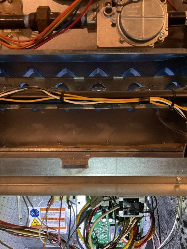 Conducted routine heating maintenance on a residential furnace system. Inspected burner assembly, electrical components, and PVC exhaust piping for proper operation. All systems functioning normally with no issues identified.