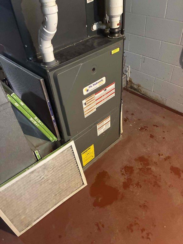 Performed routine maintenance on residential furnace system. Replaced dirty air filter and verified proper operation of the heating system. Confirmed exhaust temperature reading of 18°F on PVC flue pipe, indicating normal combustion efficiency.