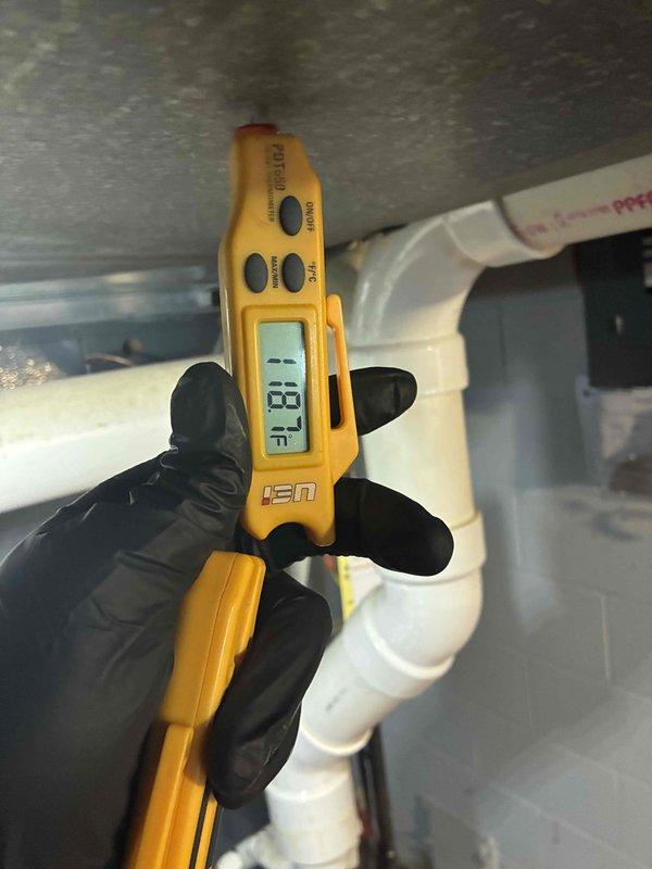 Performed routine maintenance on residential furnace system. Replaced dirty air filter and verified proper operation of the heating system. Confirmed exhaust temperature reading of 18°F on PVC flue pipe, indicating normal combustion efficiency.