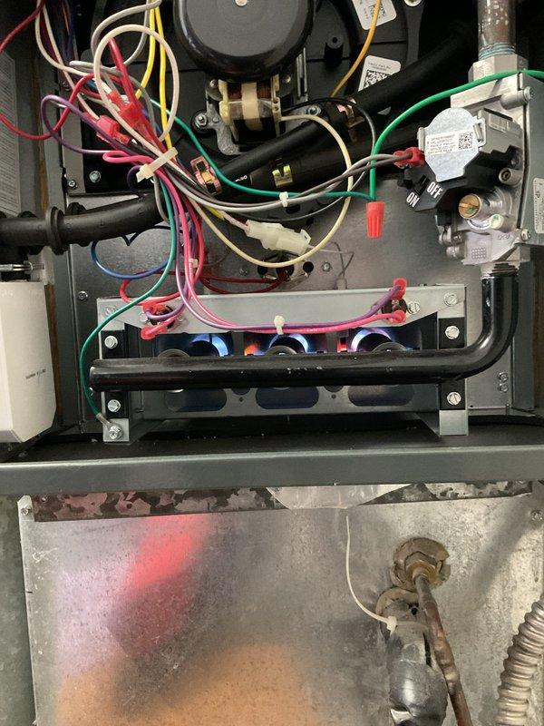 Performed routine heating system maintenance on customer's furnace. Inspected circuit board, electrical connections, and burner assembly - all components functioning properly. Discussed smart thermostat options as requested by customer.