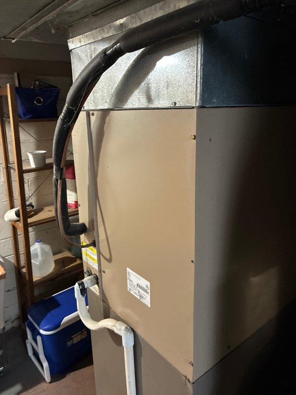 Performed evaluation of existing HVAC system for full replacement options. System showed significant age with deteriorated wall penetration and compromised sealing around ductwork. Customer referenced previous successful installation at family member's residence, indicating preference for similar setup in this easily accessible location.