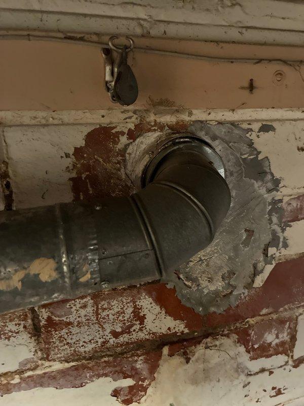 Performed evaluation of existing HVAC system for full replacement options. System showed significant age with deteriorated wall penetration and compromised sealing around ductwork. Customer referenced previous successful installation at family member's residence, indicating preference for similar setup in this easily accessible location.