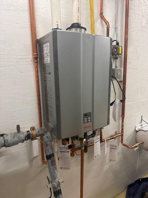 Performed routine maintenance flush on customer's wall-mounted Rinnai tankless water heater. Inspected all copper pipe connections, valves, and electrical components for proper function. System is operating correctly with no issues found during service.