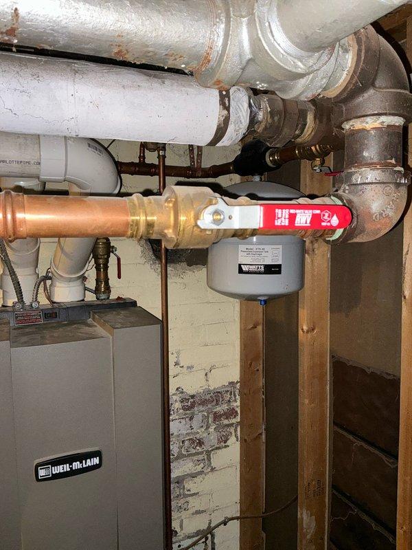 Conducted boiler assessment at residential property, examining existing Weil-McLain heating unit and associated plumbing components. Evaluated condition of copper piping, expansion tank, and valve connections. Provided customer with various boiler replacement options based on system requirements and current installation configuration.