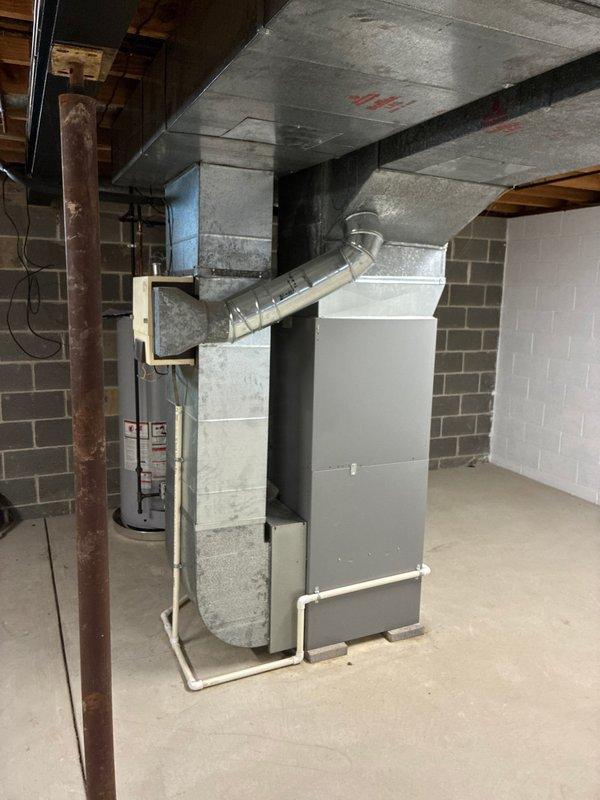 Conducted comprehensive assessment of existing HVAC system in customer's basement per customer request. Inspection revealed aging furnace experiencing operational issues that warrant replacement. Documented current setup including furnace unit, ductwork configuration, and adjacent water heater to prepare accurate replacement estimate. System evaluation complete and replacement options prepared for customer review.