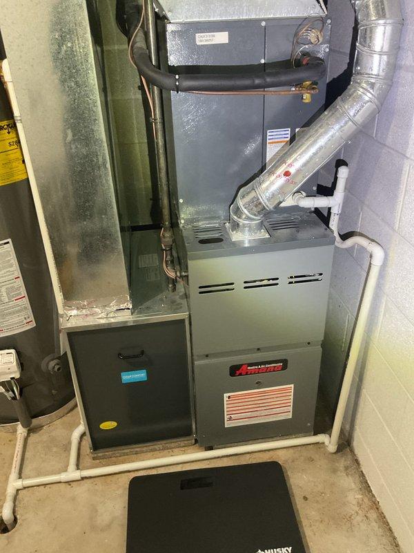 Performed monthly heating maintenance service on Amana furnace system. Inspected burner assembly confirming proper flame characteristics and verified control board functionality with all wiring connections secure. System operating normally with no issues identified.