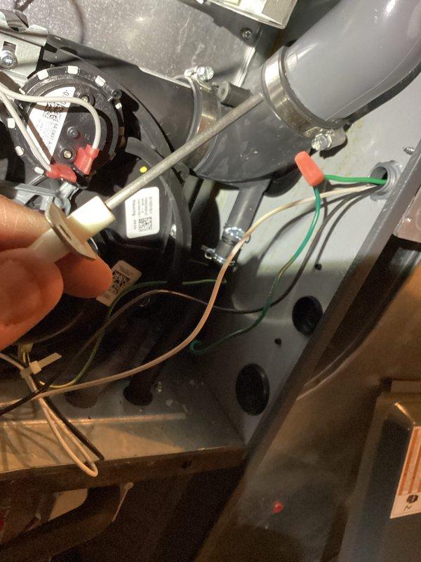 Performed scheduled monthly heating maintenance on HVAC system. Inspected internal components including electrical connections and PVC venting. Conducted electrical testing with multimeter to verify proper voltage readings (0.223V and 0.044V) on control board connections, ensuring system operates within manufacturer specifications.