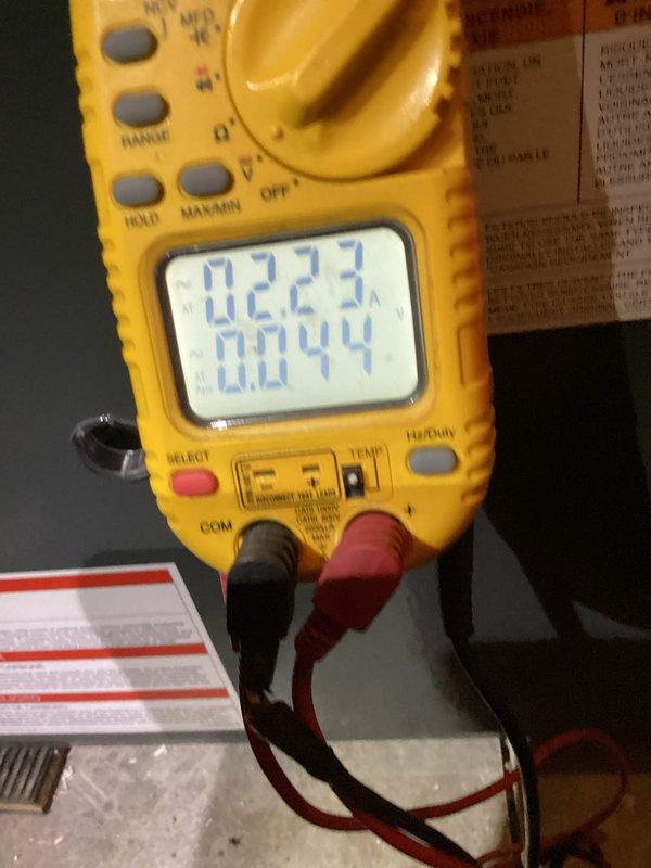 Performed scheduled monthly heating maintenance on HVAC system. Inspected internal components including electrical connections and PVC venting. Conducted electrical testing with multimeter to verify proper voltage readings (0.223V and 0.044V) on control board connections, ensuring system operates within manufacturer specifications.