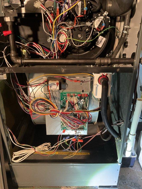 Performed scheduled heating maintenance on HVAC system. Inspected electrical connections, control board, and blower motor assembly, ensuring all wire harnesses were properly secured and functioning correctly. System was returned to service in good working condition.