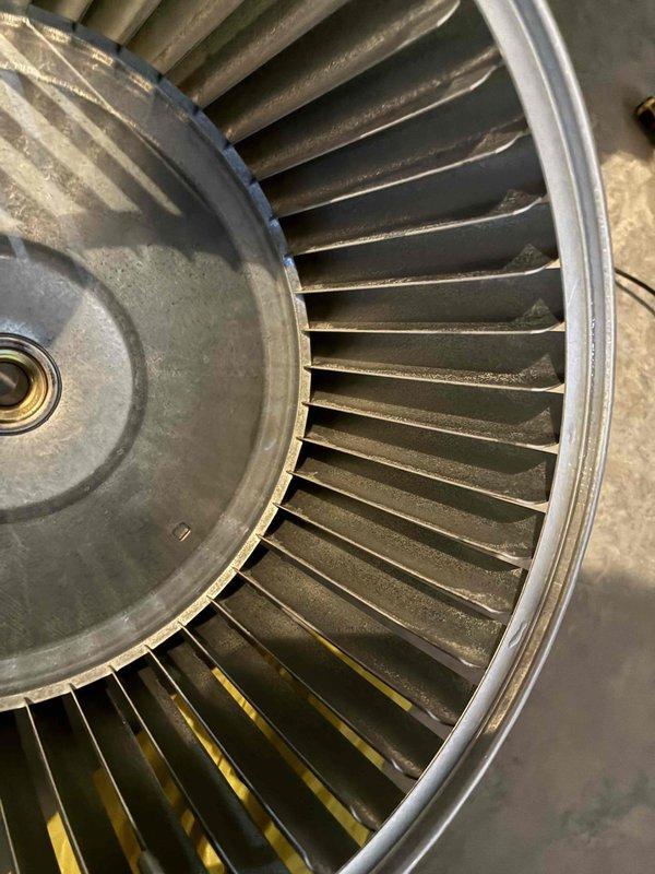 Performed comprehensive blower wheel cleaning service on HVAC system. Removed cylindrical metal blower wheel assembly, thoroughly cleaned accumulated dust and debris from all fan blades and housing, then reinstalled component to restore optimal airflow and system efficiency.