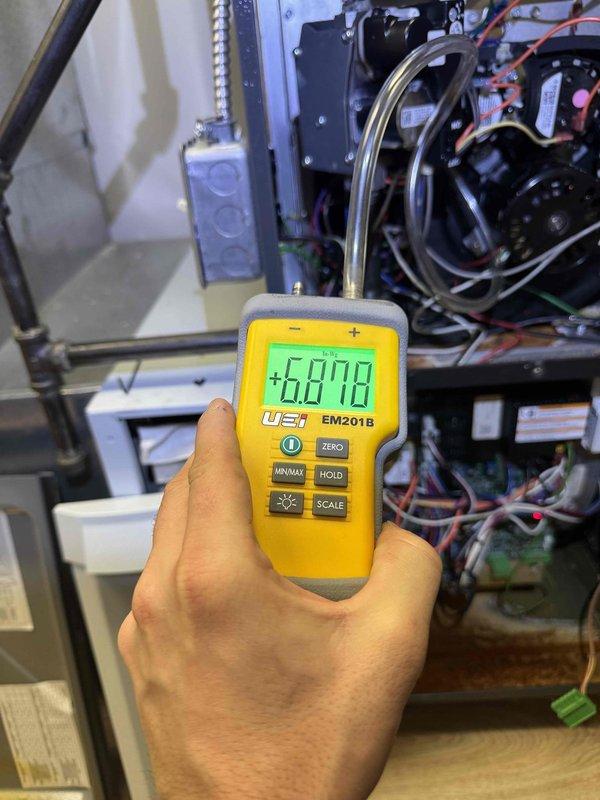 Responded to no heat complaint on lower level of residence. Accessed HVAC unit and performed diagnostic testing with digital multimeter (UEi EM201B), which revealed high resistance reading (+6010) in the system. Identified and replaced faulty component to restore proper heat function to the lower level.