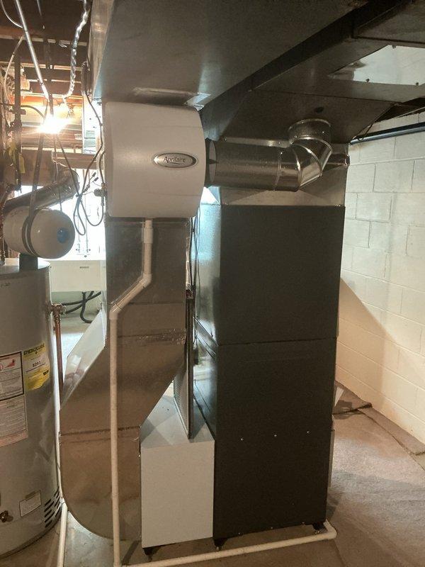 Performed routine maintenance on a 6-year-old P.E. Wadsworth furnace system with attached Aprilaire humidifier. Inspected all components including PVC intake/exhaust vents, ductwork connections, and electrical systems. System is functioning properly with no issues identified.