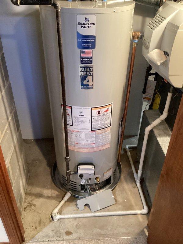 Installed new 50-gallon Bradford White short water heater with complete code-compliant upgrades. System includes properly mounted expansion tank, new copper supply lines with brass fittings, and updated ventilation components. All connections were tested and verified to be functioning correctly.