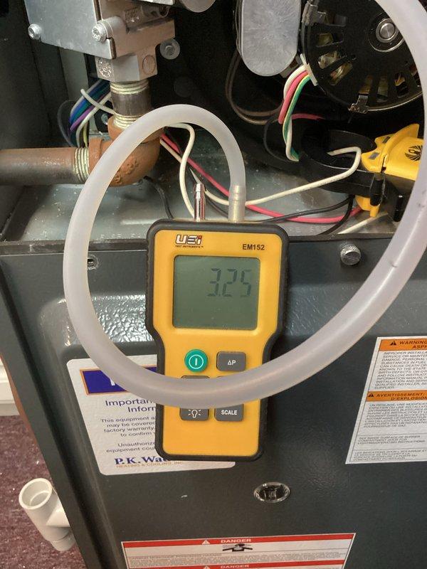 Performed routine heating maintenance on residential HVAC system. Conducted pressure differential testing using Testo 310 analyzer showing readings of 7.73/6.7, and verified gas pressure measurements (325) with EM152 manometer. All system parameters within normal operating range; unit functioning properly after service.