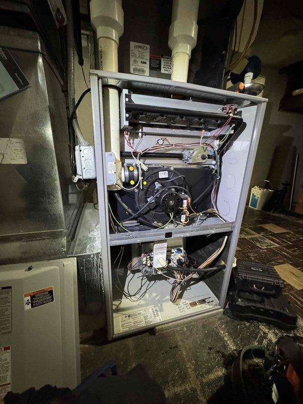 Performed scheduled heating tune-up service on two identical furnace systems (84/84). Conducted full inspection with front panels removed to access internal components. Tested combustion efficiency using Testo 310 analyzer, which measured 10.7% CO2 and 75.2% temperature readings, indicating proper operation within specifications. Both systems were functioning correctly with no issues detected.