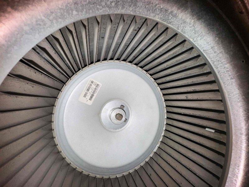 Performed scheduled heating tune-up maintenance on HVAC system. Inspected blower wheel assembly which appeared in good condition with no visible damage or debris. Noted significant dust accumulation on existing Filtrete 20x25x1 air filter and verified proper airflow direction as marked on installation area.