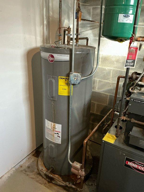Conducted comprehensive evaluation of existing hydronic heating system featuring dual Hydrotherm boilers and a Rheem Professional water heater with direct integration. System includes expansion tank and extensive copper piping network with multiple valves and gauges. Assessment performed to determine feasibility of replacing with 1-2 combi boiler units as requested by customer.