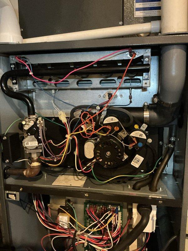 Performed routine maintenance on residential furnace system. Inspected blower motor assembly, control board, and electrical connections throughout unit. All components found to be in proper working condition with no issues identified.