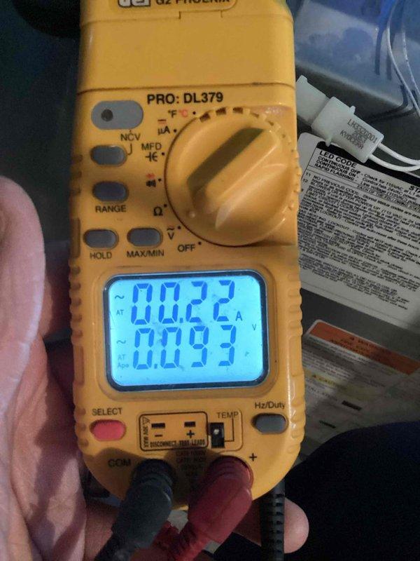 Performed routine heating tune-up service on HVAC system. Conducted electrical diagnostics using multimeter, measuring amperage (0.022A) and voltage (0.093V) to verify proper electrical parameters. Inspected and reconnected internal wiring harness to ensure secure connections to control board.