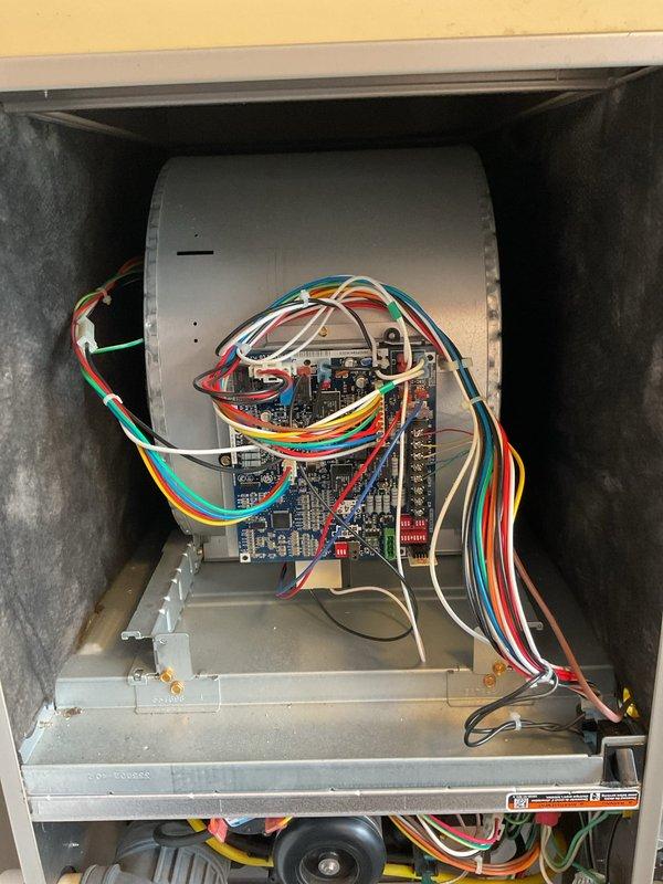 Performed scheduled winter maintenance on a Carrier HVAC system. Inspected blower motor assembly, circuit board connections, and wiring integrity. Examined filter housing (Filter No. 413) and checked PVC venting system and copper line connections. All components operating within normal parameters.