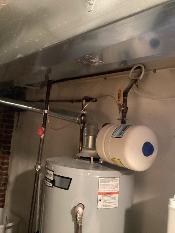 Installed combination Arc Fault/GFCI breakers in service panel and bonded water pipes for electrical safety compliance. Verified proper operation of expansion tank on water heater system and labeled all circuits in the panel for clear identification.