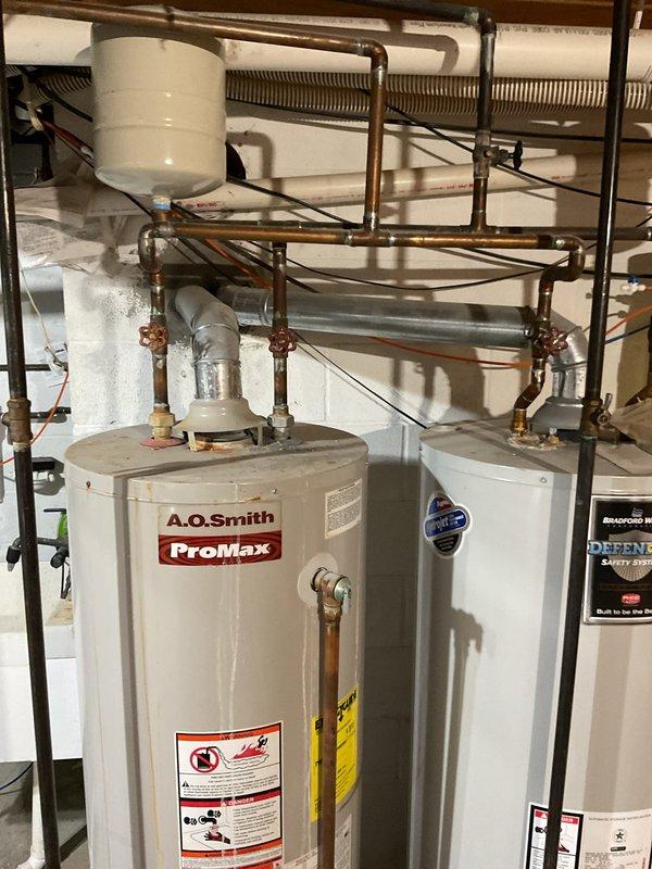 Responded to customer complaint of unusual odor (described as "boiling potatoes") emanating from HVAC system. Upon inspection, determined issue was not HVAC-related but originated from the water heating system, which includes an A.O. Smith ProMax water heater and Bradford secondary tank with associated copper piping and expansion tank. Advised customer that plumbing service would be required to address the odor source.