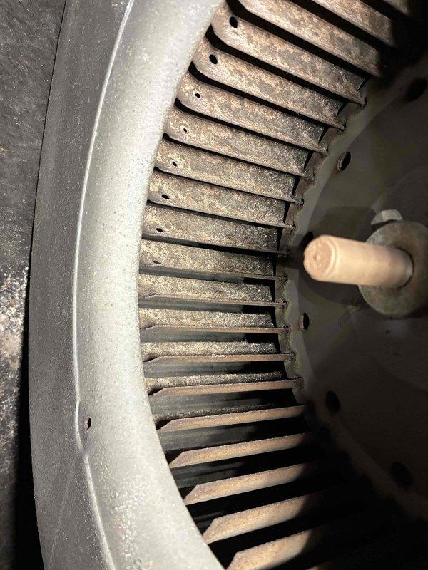 Performed scheduled heating maintenance on 10+ year old system. Inspected furnace and ductwork, noting dust accumulation on blower wheel fins. Cleaned components and verified proper system operation.