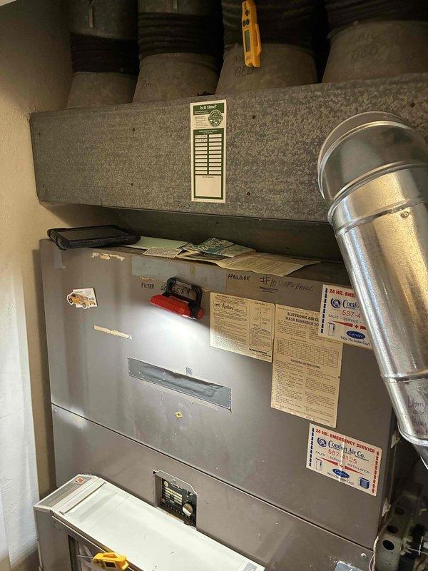 Performed scheduled heating maintenance on 10+ year old system. Inspected furnace and ductwork, noting dust accumulation on blower wheel fins. Cleaned components and verified proper system operation.