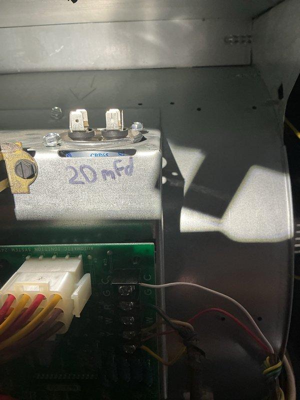 Responded to furnace cycling issue reported by customer. Diagnostic testing revealed faulty 20 MFD capacitor in control board assembly. Performed pressure measurements with manometer (3.39" WC) to verify proper gas pressure. Replaced capacitor to resolve intermittent operation problem.
