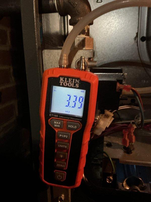 Responded to furnace cycling issue reported by customer. Diagnostic testing revealed faulty 20 MFD capacitor in control board assembly. Performed pressure measurements with manometer (3.39" WC) to verify proper gas pressure. Replaced capacitor to resolve intermittent operation problem.