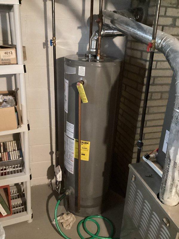 Performed maintenance on a tanked water heater that was not heating properly, exhibiting intermittent heating performance. Repaired leaking copper pipe in basement utility area and resolved faucet operation issues affecting on/off functionality.