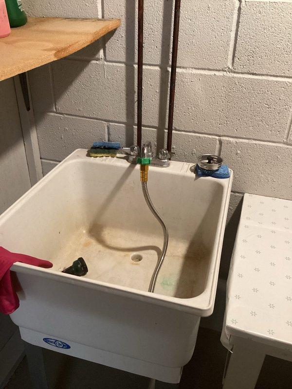 Performed maintenance on a tanked water heater that was not heating properly, exhibiting intermittent heating performance. Repaired leaking copper pipe in basement utility area and resolved faucet operation issues affecting on/off functionality.