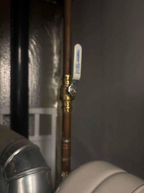 Installed new expansion tank and shut-off valve on customer's A.O. Smith ProLine water heater system. Properly connected components using copper piping and brass fittings, ensuring all connections were securely soldered and leak-free.