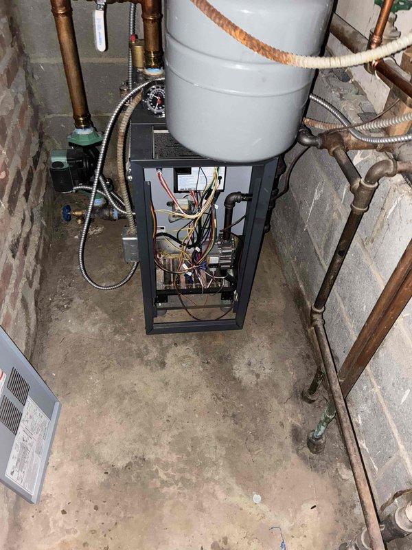 Diagnosed and repaired a radiant heating system boiler that was shutting off prematurely before reaching the thermostat setpoint. Inspection of the control board revealed loose wiring connections at the main control module that were causing intermittent operation. Secured all electrical connections, cleaned flame sensor, and verified proper ignition sequence. System now maintains consistent operation and achieves desired temperature settings.