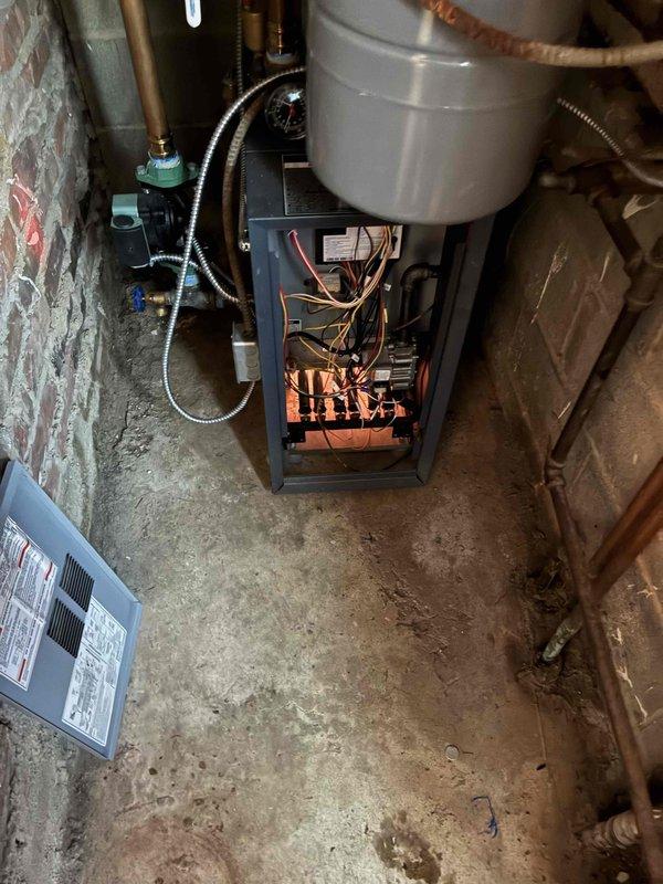 Diagnosed and repaired a radiant heating system boiler that was shutting off prematurely before reaching the thermostat setpoint. Inspection of the control board revealed loose wiring connections at the main control module that were causing intermittent operation. Secured all electrical connections, cleaned flame sensor, and verified proper ignition sequence. System now maintains consistent operation and achieves desired temperature settings.