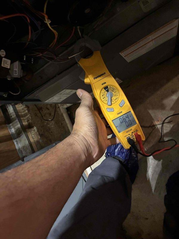Performed monthly heating maintenance service on HVAC system. Conducted electrical testing with clamp meter showing 67 amps and used Testo S10 device to verify system parameters with reading of 12.2. All components operating within normal specifications.