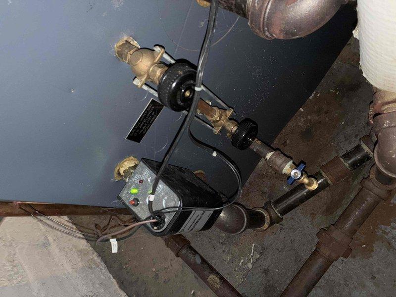 Completed routine boiler maintenance service including inspection of the heat exchanger tubes and control valve assembly. Replaced thermostat battery and verified proper system operation. Noted minor corrosion on copper supply lines and one damaged heat exchanger tube that should be monitored during next scheduled maintenance.