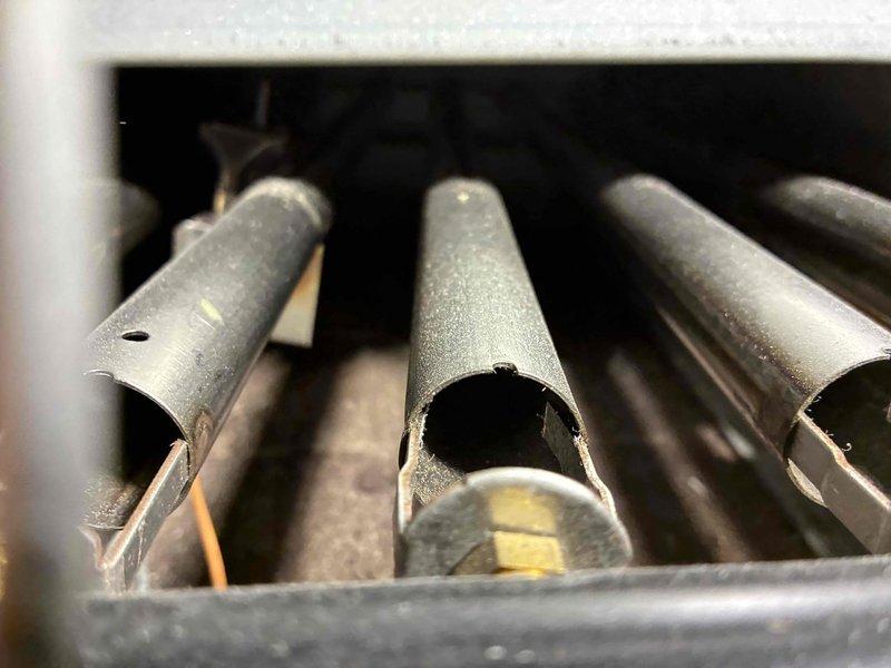 Completed routine boiler maintenance service including inspection of the heat exchanger tubes and control valve assembly. Replaced thermostat battery and verified proper system operation. Noted minor corrosion on copper supply lines and one damaged heat exchanger tube that should be monitored during next scheduled maintenance.