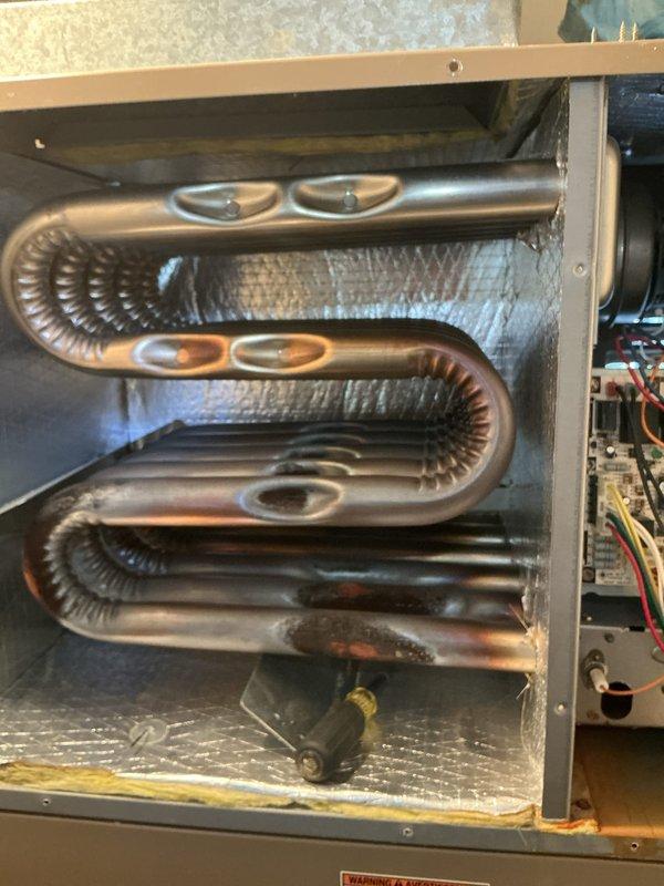 Performed monthly heating maintenance service on HVAC system. Inspected evaporator/condenser coils showing normal oxidation and examined pump assembly with attached copper piping. All components functioning properly with no issues identified.