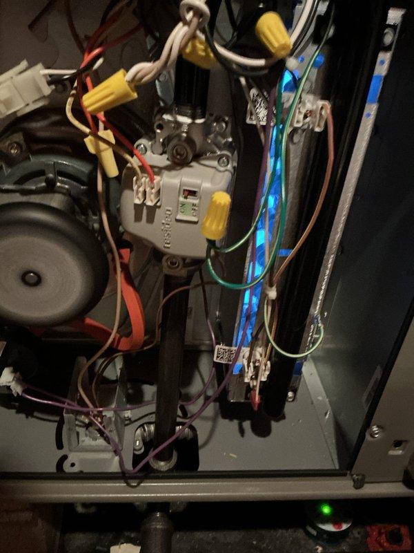 Responded to no-heat complaint on relatively new furnace system (installed August). Inspection revealed faulty wiring connections at control module and improper damper positioning in ductwork. Corrected wire connections at terminal board and adjusted mechanical damper to restore proper airflow and system operation. System now functioning normally with consistent heat output.