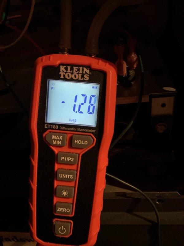 Responded to follow-up no-heat call after previous service visit. Conducted gas pressure test using Klein Tools ET180 Differential Manometer, measuring 1.26 inH₂O. Discovered thermostat displaying abnormally high temperature reading of 137°F while actual set points were 63-64°F, indicating faulty thermostat as source of heating system failure.