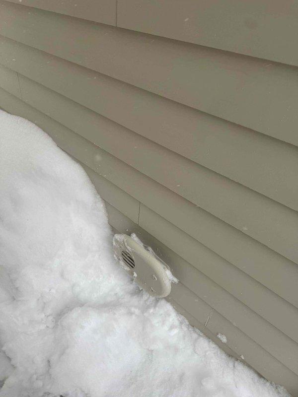 Responded to no heat complaint and found exhaust vent pipe severely obstructed by snow accumulation against exterior wall. Cleared snow and ice buildup from around the intake/exhaust termination points to restore proper system ventilation and operation, allowing furnace to resume normal heating function.