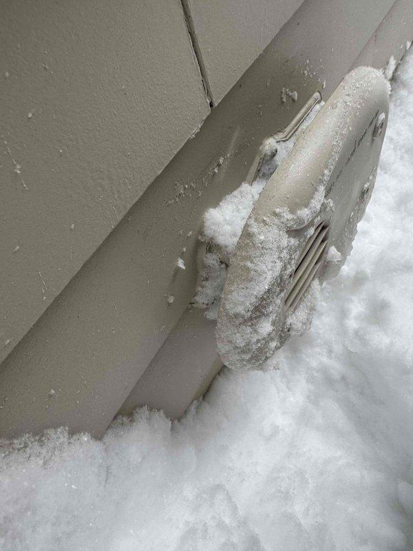 Responded to no heat complaint and found exhaust vent pipe severely obstructed by snow accumulation against exterior wall. Cleared snow and ice buildup from around the intake/exhaust termination points to restore proper system ventilation and operation, allowing furnace to resume normal heating function.