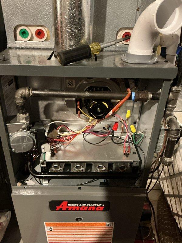 Conducted heating maintenance service on Amana HVAC system to address thermostat programming issues. Inspected internal components including motor assembly, electrical connections and wiring. Resolved random temperature change problem by reprogramming thermostat and provided customer with requested magnet.