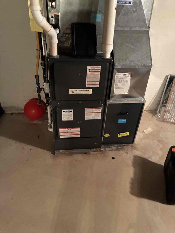 Performed routine heating maintenance service on residential furnace system. Inspected and cleaned blower assembly components including fan wheel and shaft coupling. System appears to be in proper working order with no issues identified.